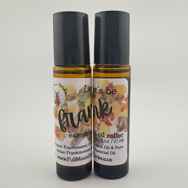 Two essential oil roller bottles with black caps on a white background. Frankincense Essential Oil Roller
