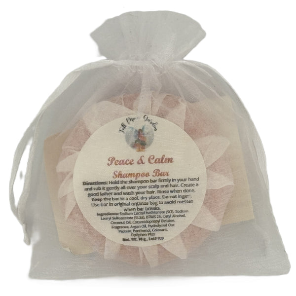 Full Moon Gardens shampoo bar in a white organza bag with a label on a white background