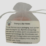 Orange Shampoo Bar in bag with instructions for use facing forward.