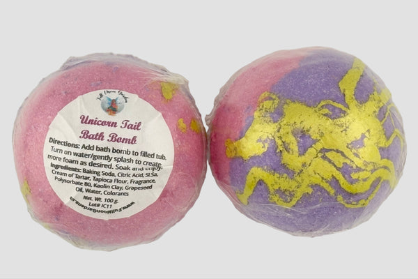 Two unicorn-themed bath bombs with a label on a white background